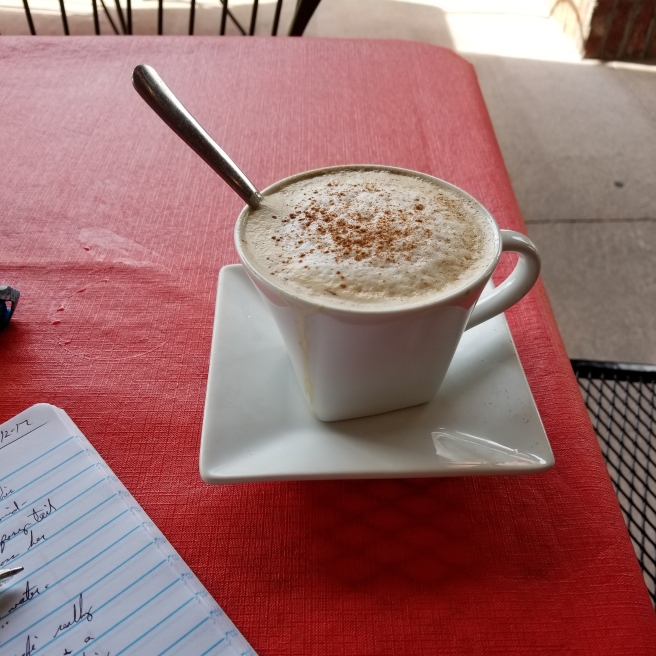 cropped-cappuccino-on-table